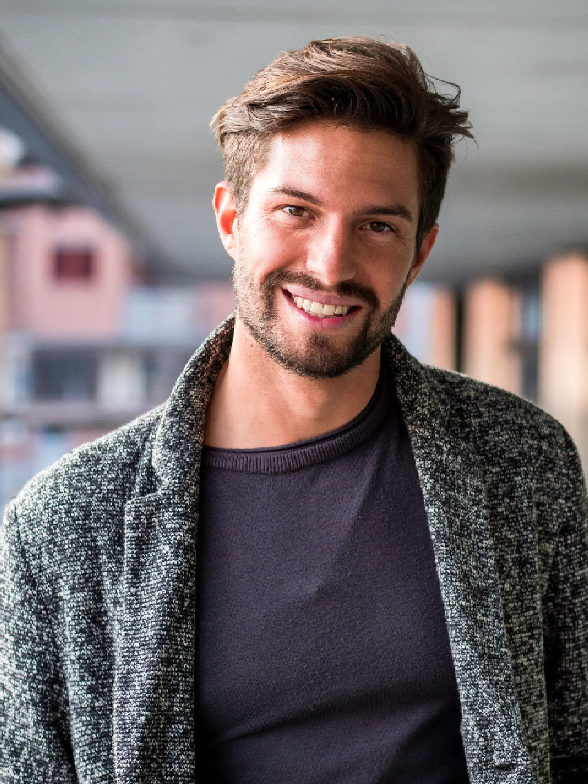 a man smiling at the camera