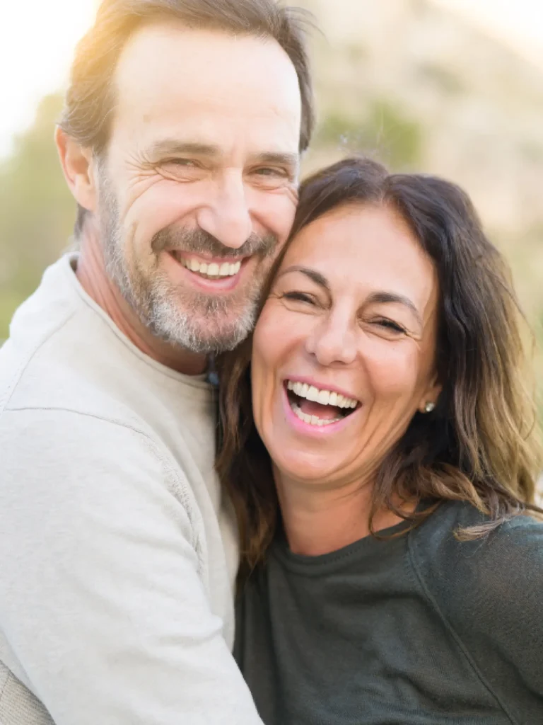 a man and woman smiling for a selfie